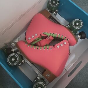 Vibrant Pink Roller Skates with Green Laces